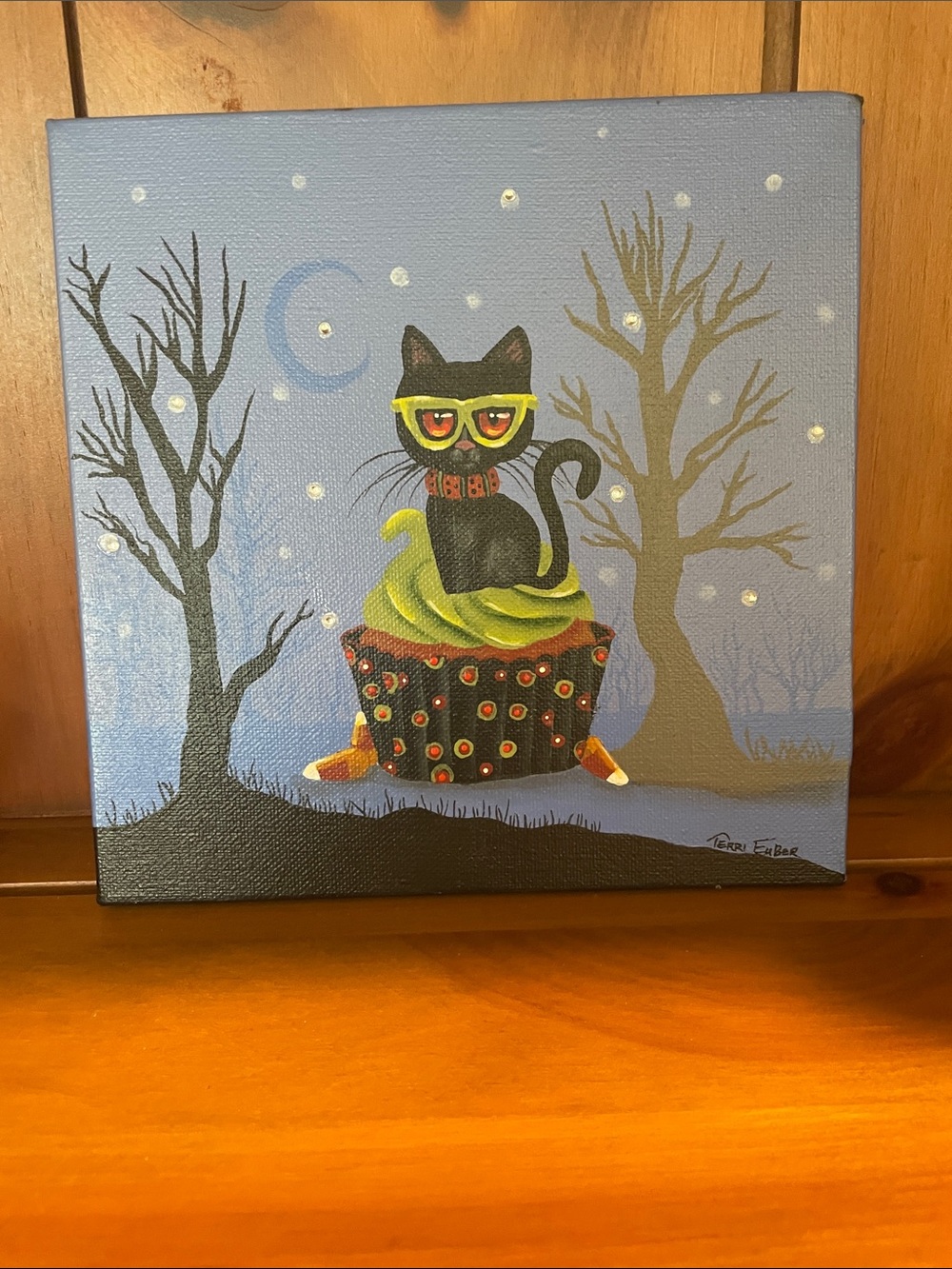 Halloween original art featuring cat on cupcake with moon .